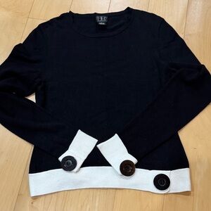 INC international crewneck black and white sweater with large button accents
